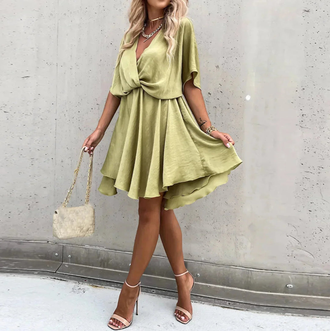 Khaki flowy dress for women, ideal for summer with a breezy design and lightweight fabric.