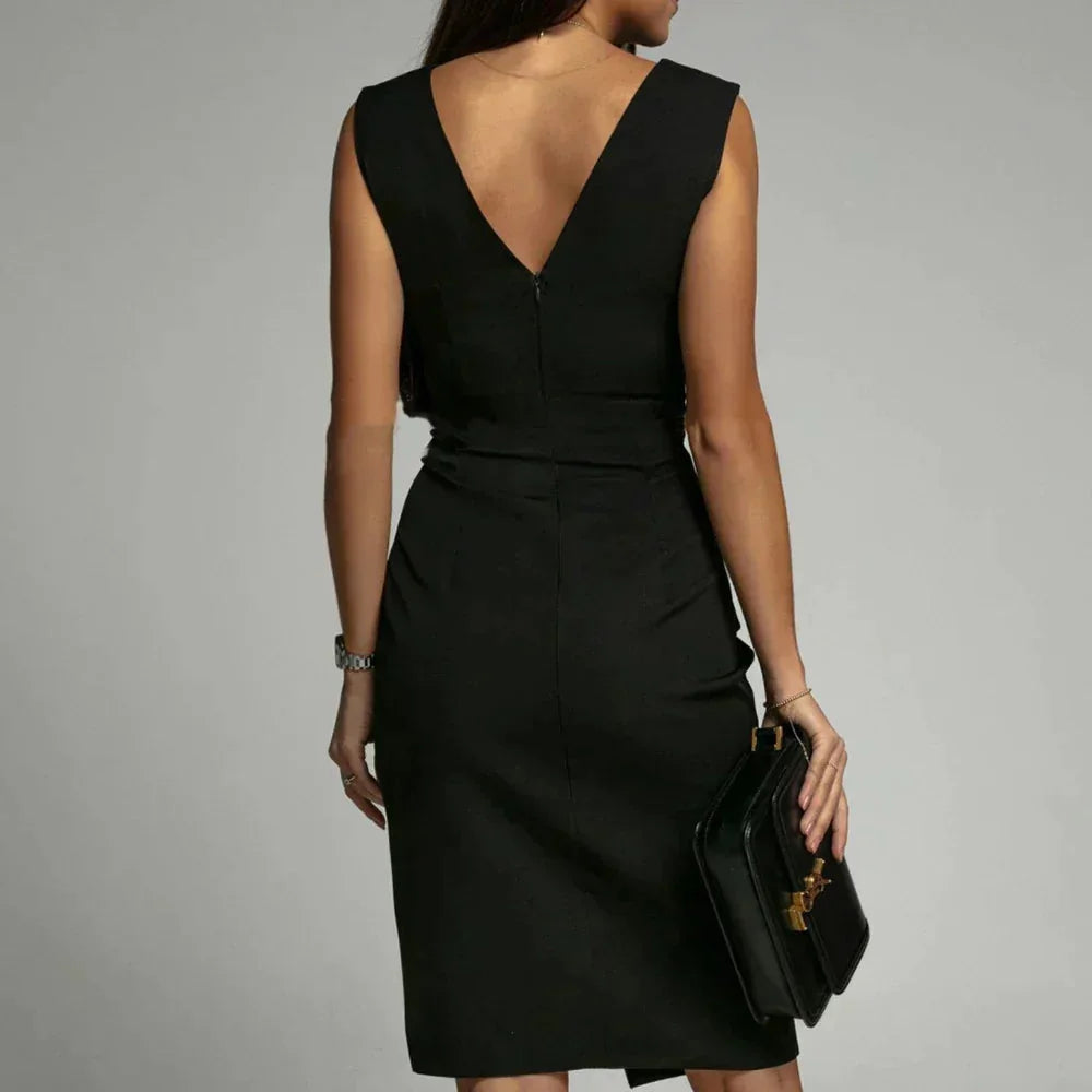 "Black V-neck dress with side slit, made of soft, flowing fabric, perfect for evenings out or special occasions."