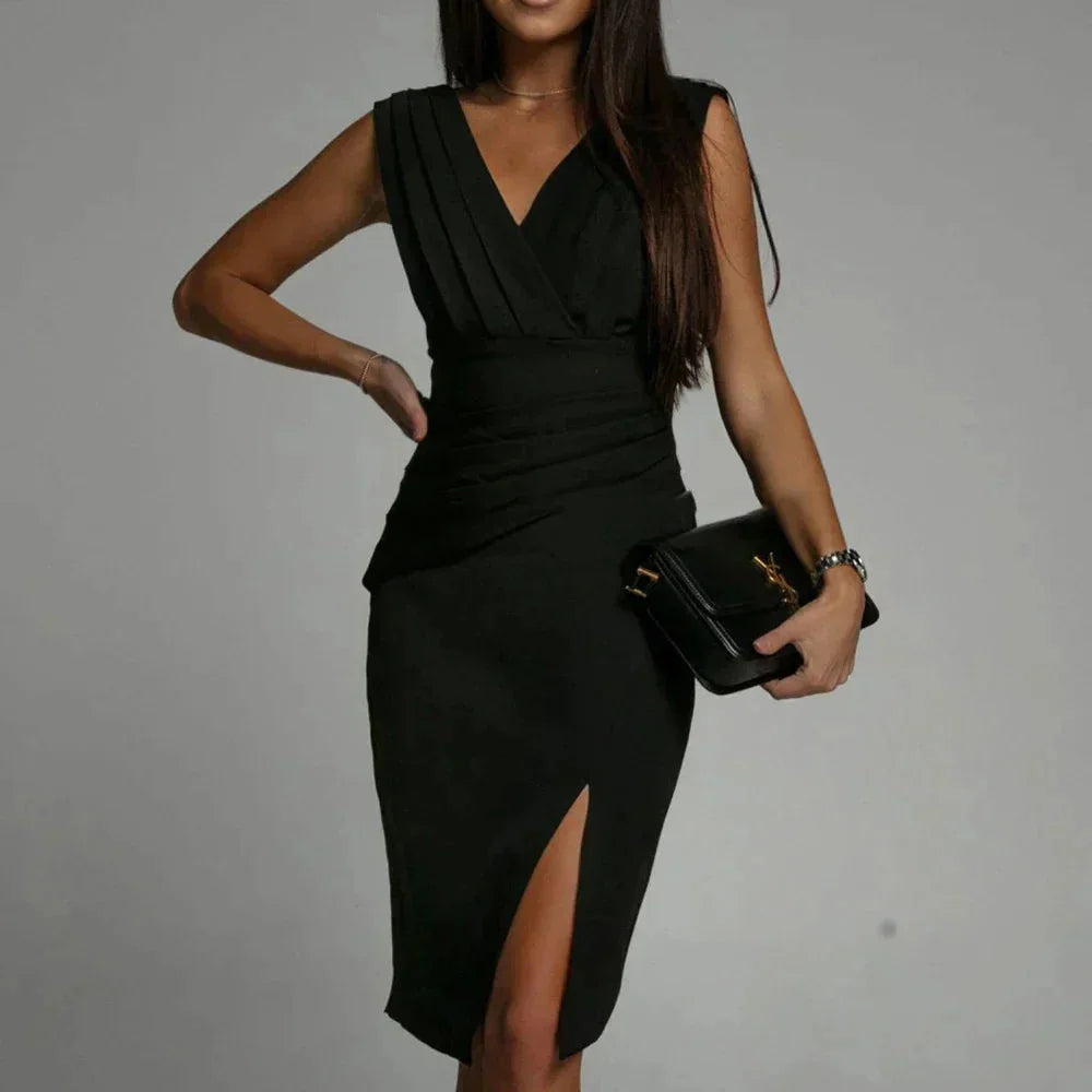 Black V-neck dress with side slit, made from soft, flowing fabric. Simple and elegant design, perfect for a night out or…