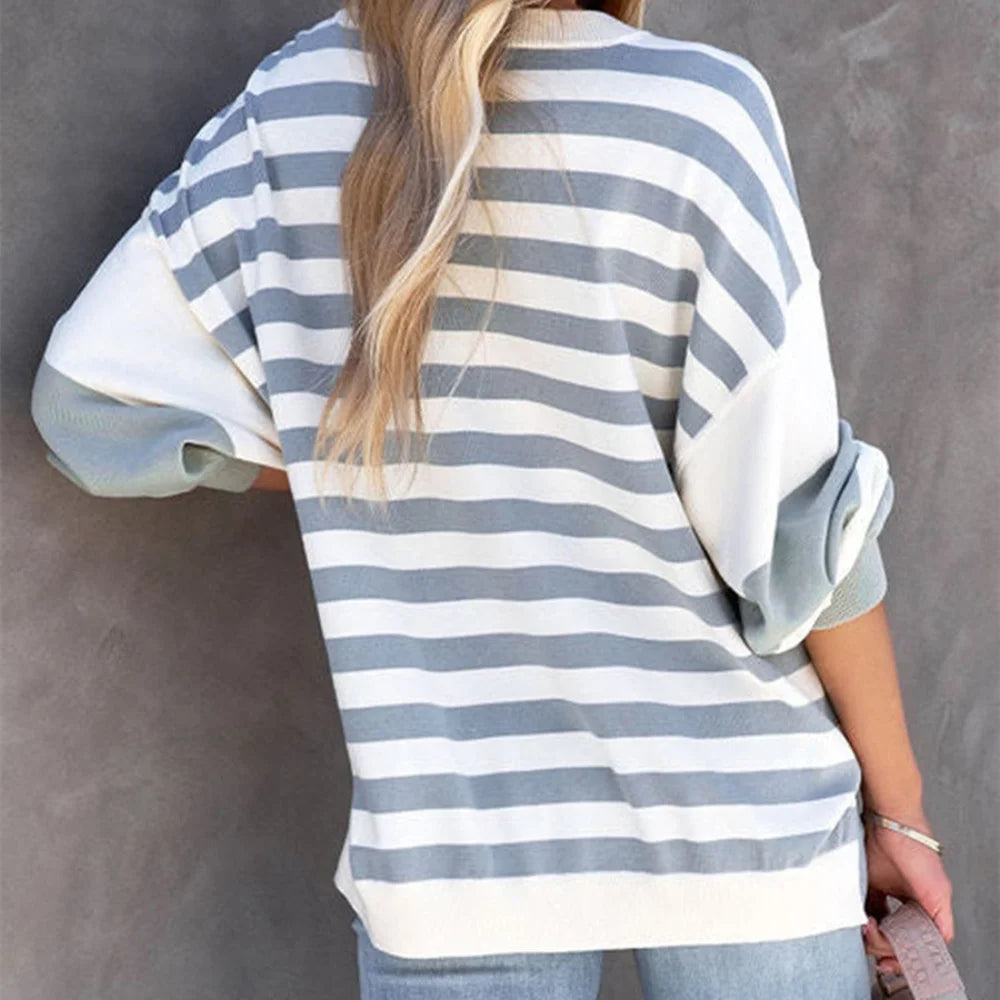 Sweater in relaxed fit made from cotton blend with striped pattern in neutral tones.