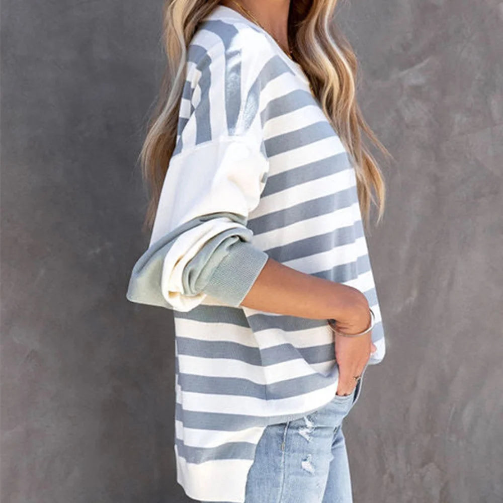 "Relaxed fit striped sweater in cotton blend fabric, perfect for casual days or layering during unpredictable weather."