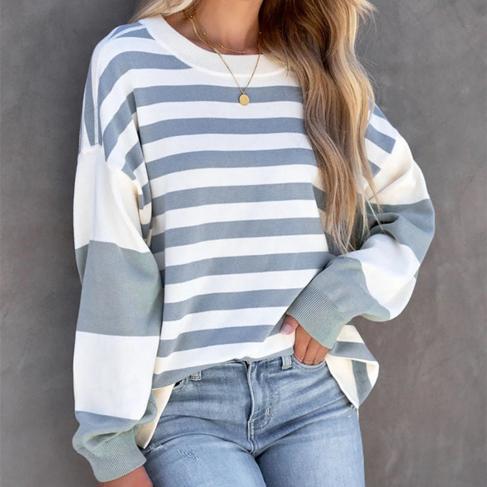 "Blakely Striped Sweater in a relaxed fit made of cotton blend fabric. Features classic striped design in versatile hues."