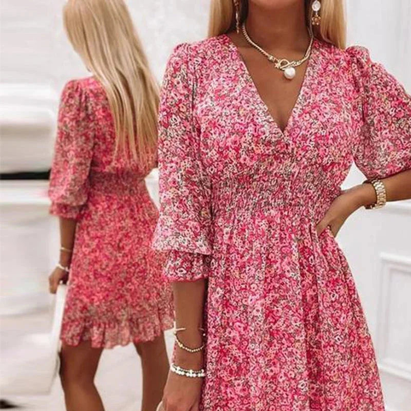 Pink floral Boho dress with a V-neck design in a soft, lightweight fabric perfect for summer.