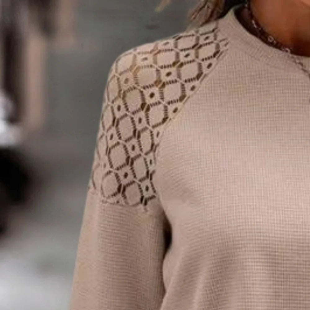 Beige sweater with delicate lace shoulder detail, perfect for adding a feminine touch to your outfit.