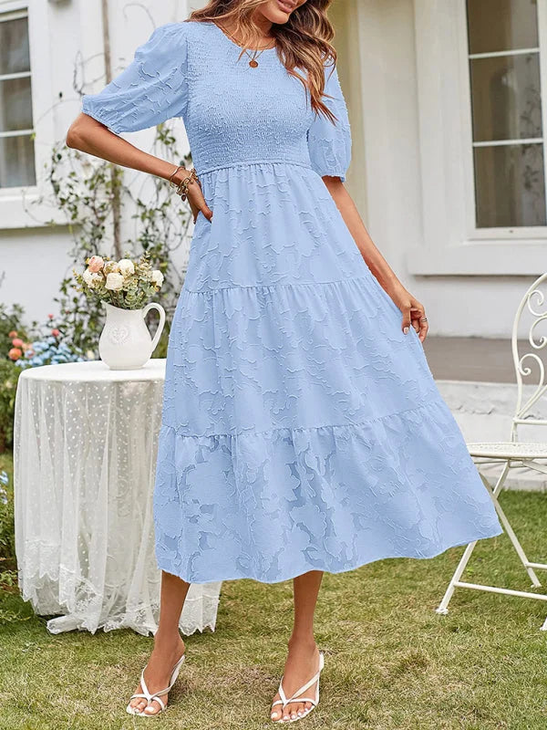 Briella midi dress in teal, tiered design with textured detail, perfect for effortless chic looks this season.