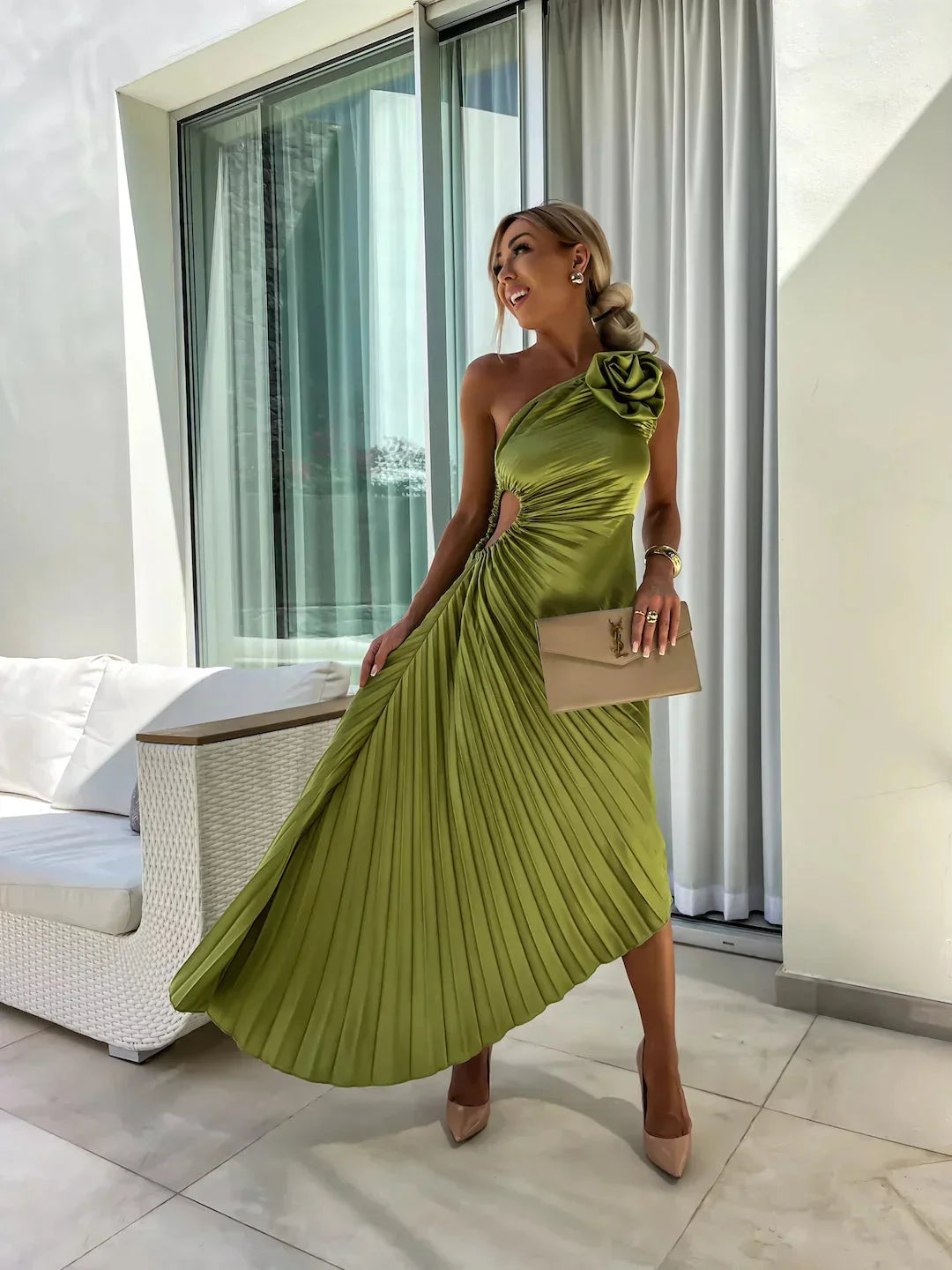 Green midi dress with pleated one-shoulder design, perfect for elegant occasions.