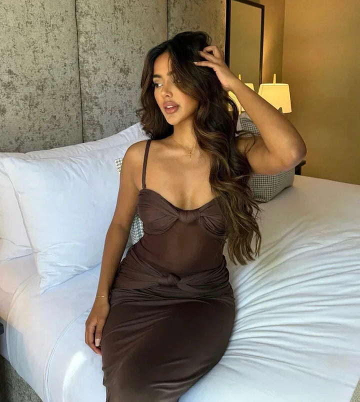 "Black strapless maxi dress with sheer detail, perfect for special occasions"