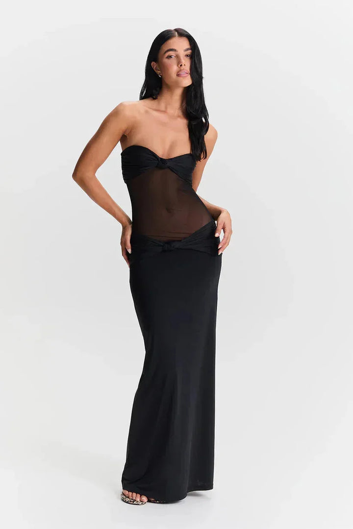 Strapless maxi dress with sheer detail, ideal for chic summer looks.