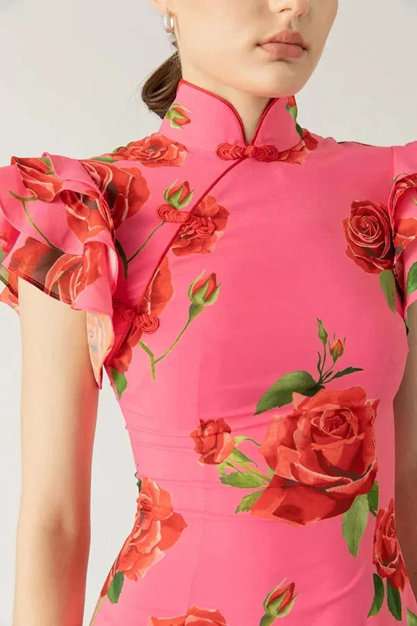 "Floral print pink maxi dress with high neckline and ruffled sleeves, perfect for a chic and feminine look."