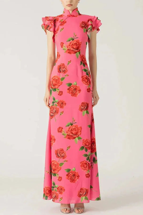 Pink maxi dress with floral print, high neckline, and ruffled sleeves. Made of lightweight, flowy fabric for a breezy and…