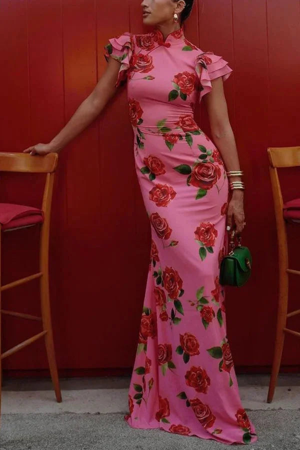 Pink floral print maxi dress with high neckline and ruffled sleeves, perfect for a feminine look.