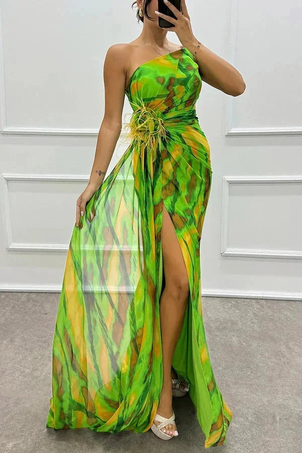 "Women's maxi dress in vibrant floral print with stylish front slit, made from soft and breathable fabric."