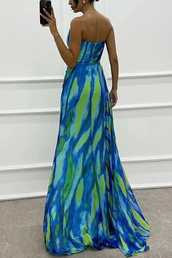 Women’s maxi dress with front slit and floral accent, made of flowy fabric in a flattering design for a stylish and…