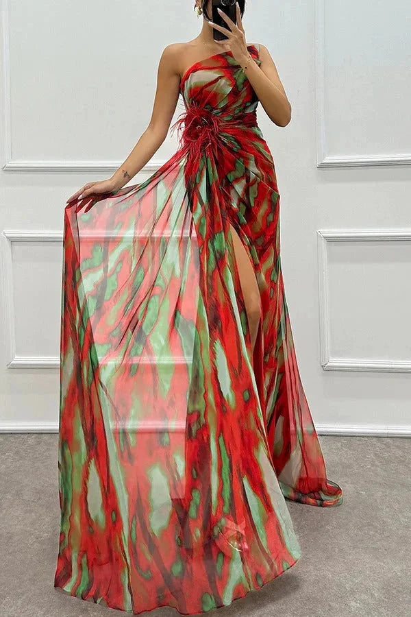 "Black maxi dress with front slit for women, featuring a delicate floral accent design."