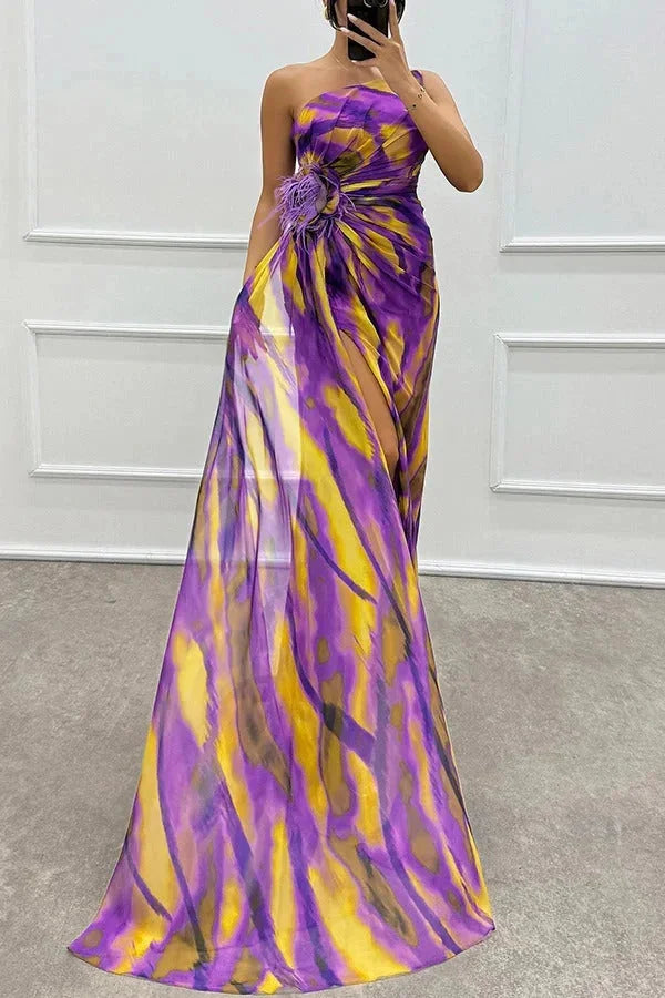 "Black maxi dress with front slit and floral accent for women, perfect for a feminine and elegant look."