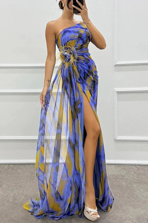 "Women’s maxi dress in floral print, featuring front slit. Made of lightweight fabric, perfect for summer outings."