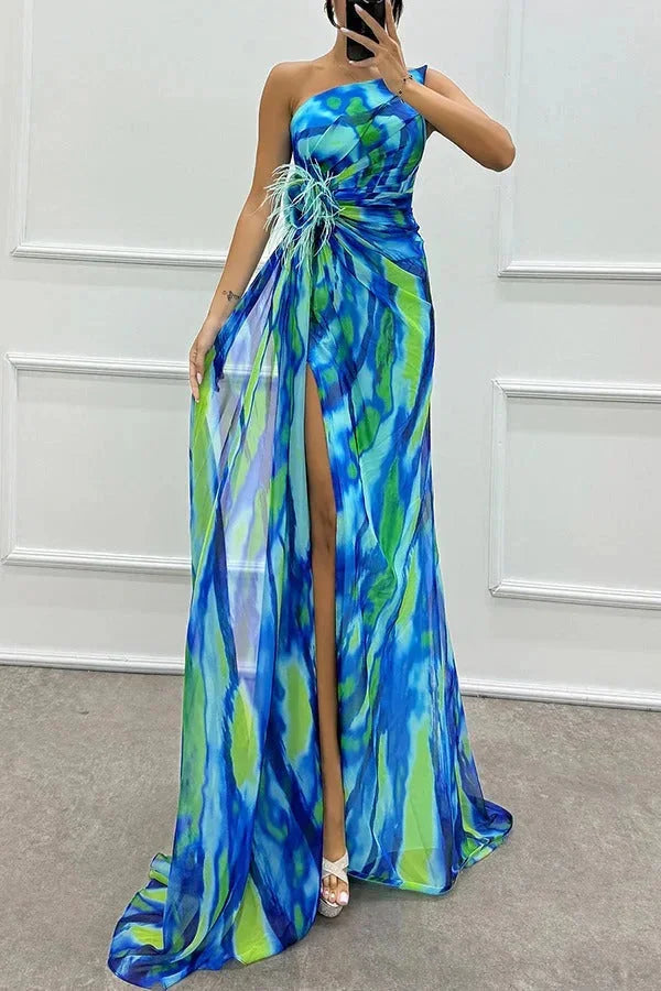 Women’s maxi dress in Cyan with a front slit and floral accent, crafted from lightweight, breathable fabric for a stylish…