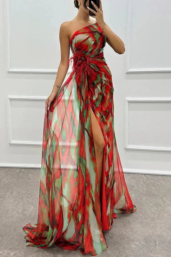 Red maxi dress for women with front slit and floral accent. Made with flowy fabric, perfect for a casual yet stylish look.