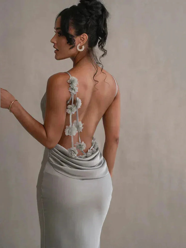 Pale green maxi dress with an open back for women, showcasing a breezy and elegant design perfect for summer days.