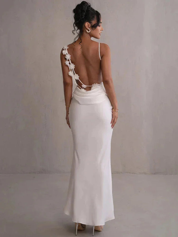"Women's pale green maxi dress in White, open back design, crafted from soft and flowy fabric, perfect for elegant summer…