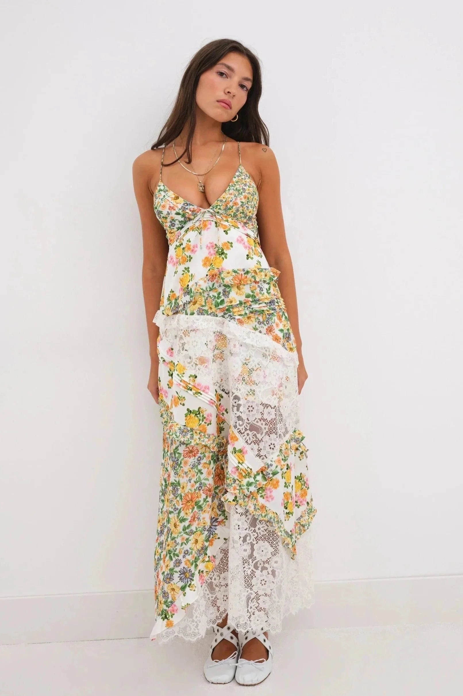 "Connie airy layered floral dress with delicate chiffon fabric, vibrant floral prints, and flowing silhouette."