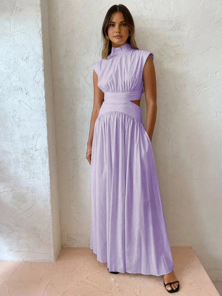 Sleeveless mock neck dress with cutouts in lustrous satin fabric, elegant and modern design perfect for any occasion.