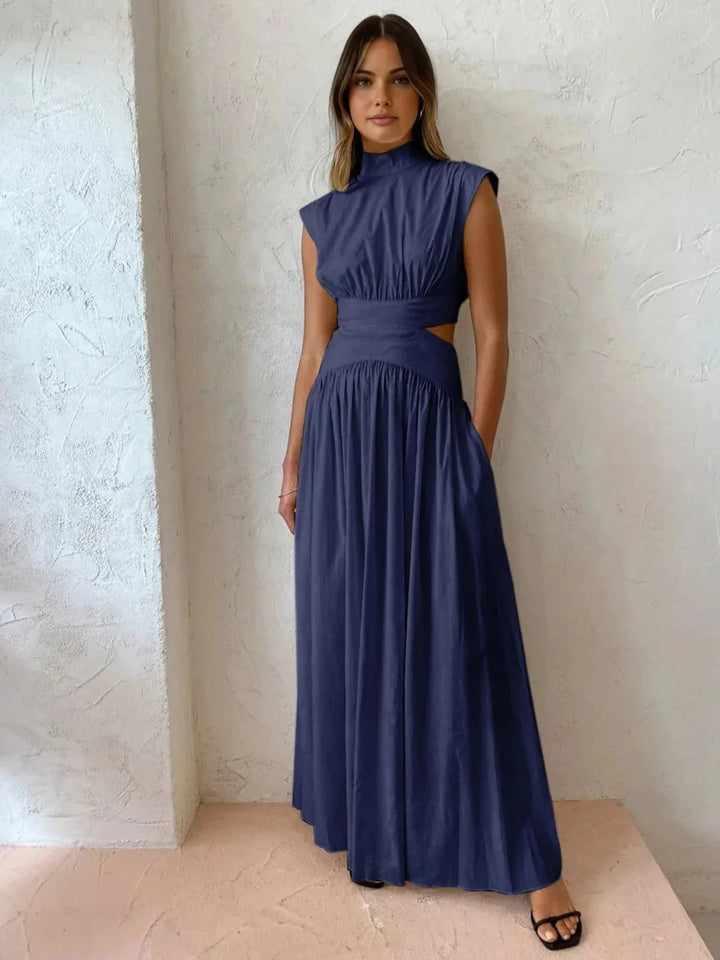 Sleeveless mock neck dress with cutouts, made from soft cotton blend fabric in a figure-flattering silhouette.