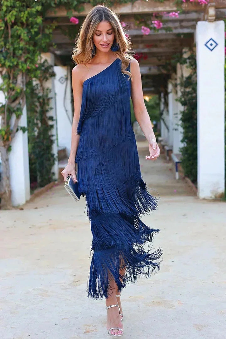 "Blue asymmetrical dress with fringe detail, made of flowy fabric ideal for casual and formal occasions."