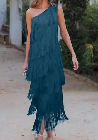Green flowy asymmetrical dress with fringe detail for women, perfect for casual wear. Made of lightweight, comfortable…