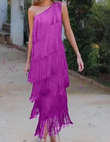 Purple asymmetrical dress with fringe detail, flowy silhouette. Made of lightweight fabric. Perfect for casual or special…
