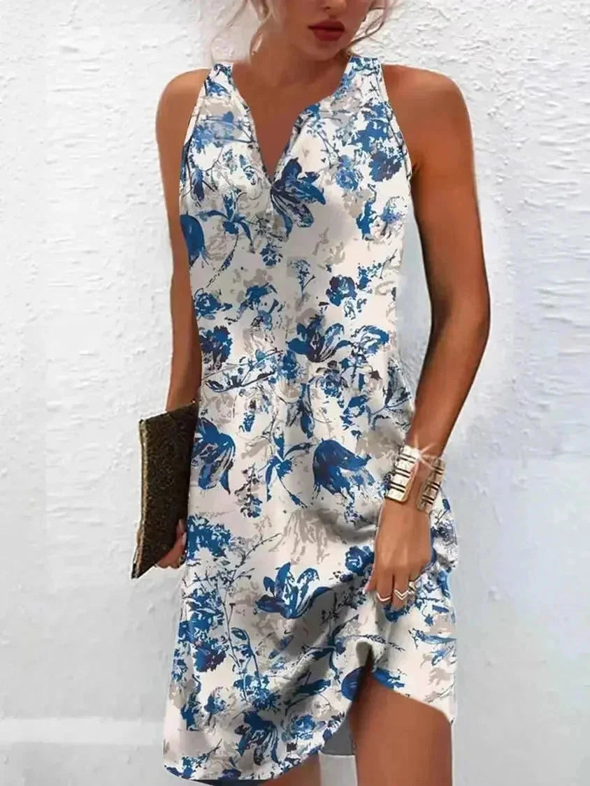 Light blue floral boho dress featuring a sleeveless design and V-neck, perfect for summertime, made with soft and breathable…