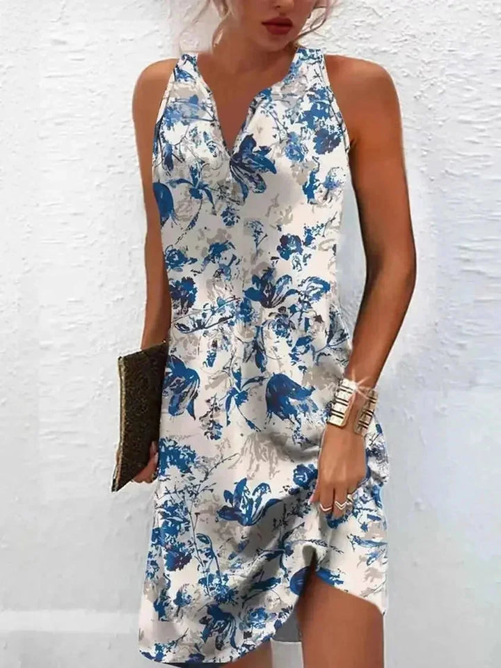 Light blue floral boho dress featuring a sleeveless design and V-neck, perfect for summertime, made with soft and breathable…