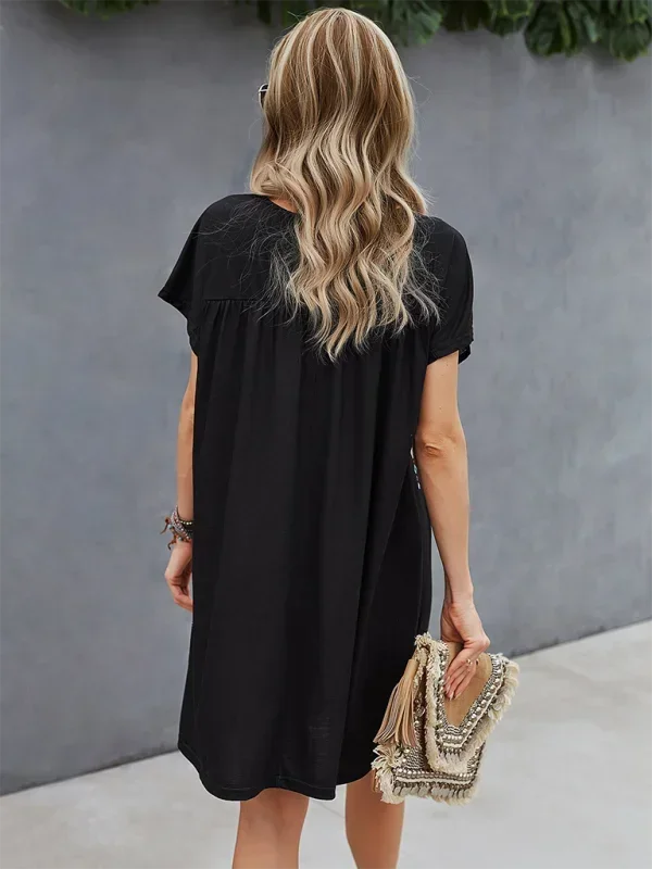 "Embroidered boho dress with relaxed fit, features intricate detailing and loose silhouette, perfect for a laid-back yet…