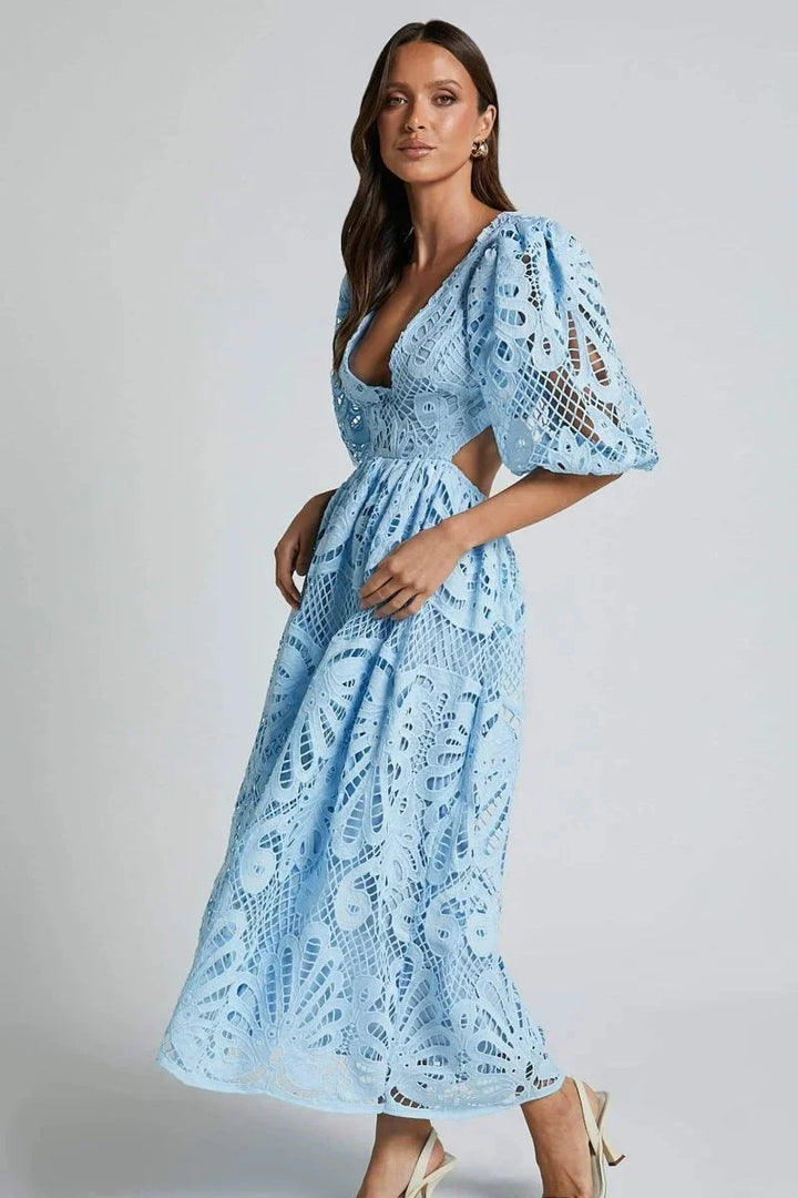 "Women's lace midi dress in soft blush with elegant flutter sleeves, perfect for special occasions."
