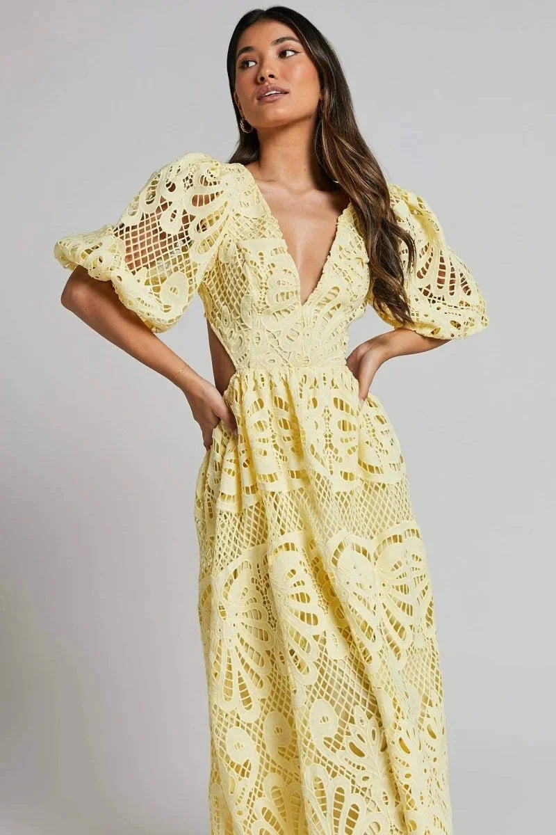 Women's black lace midi dress with flutter sleeves, perfect for special occasions.