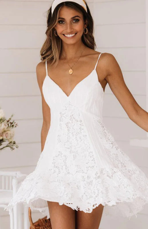 "White v-neck lace mini dress with floral pattern design, perfect for special occasions."