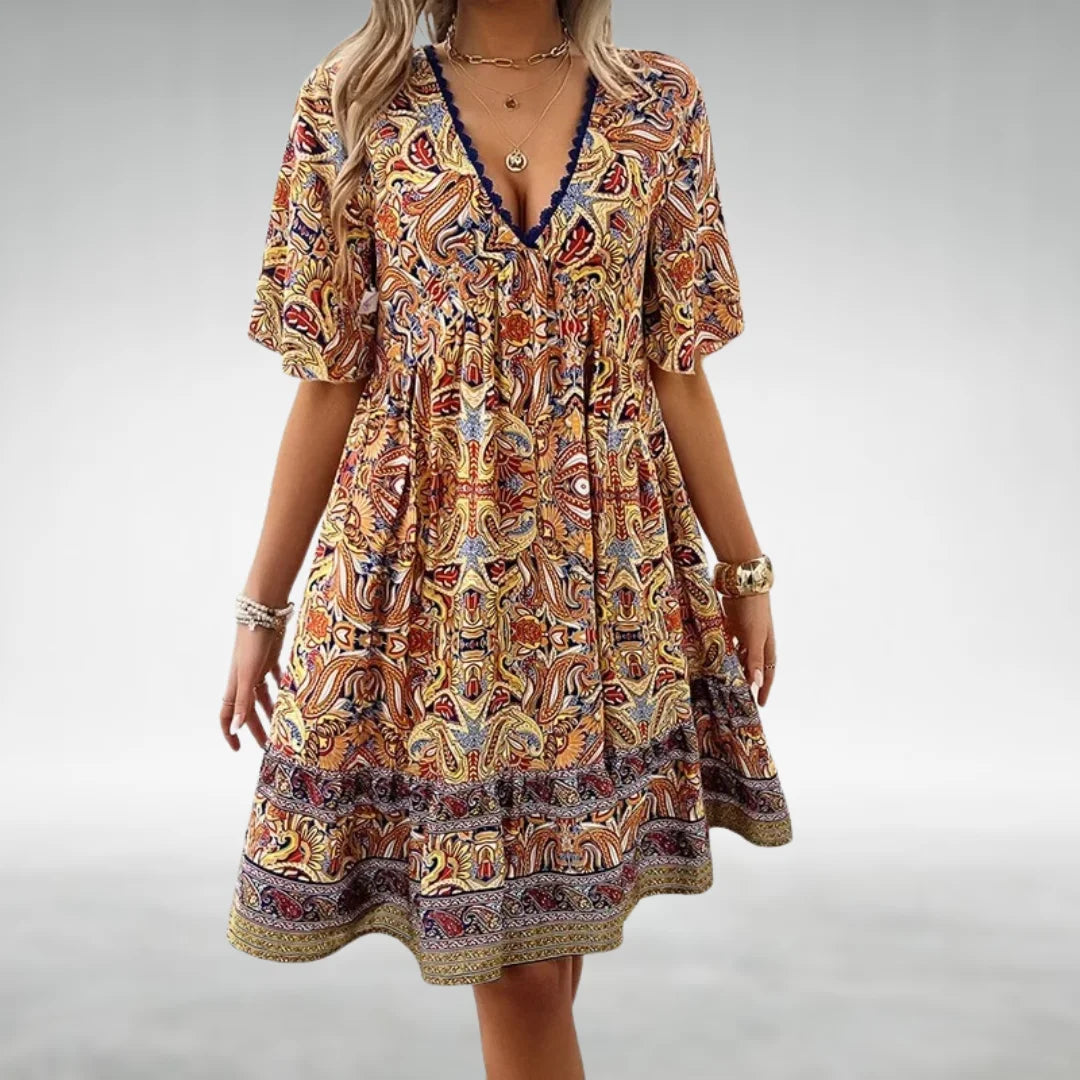 Yellow bohemian style dress with paisley design, perfect for a free-spirited look.