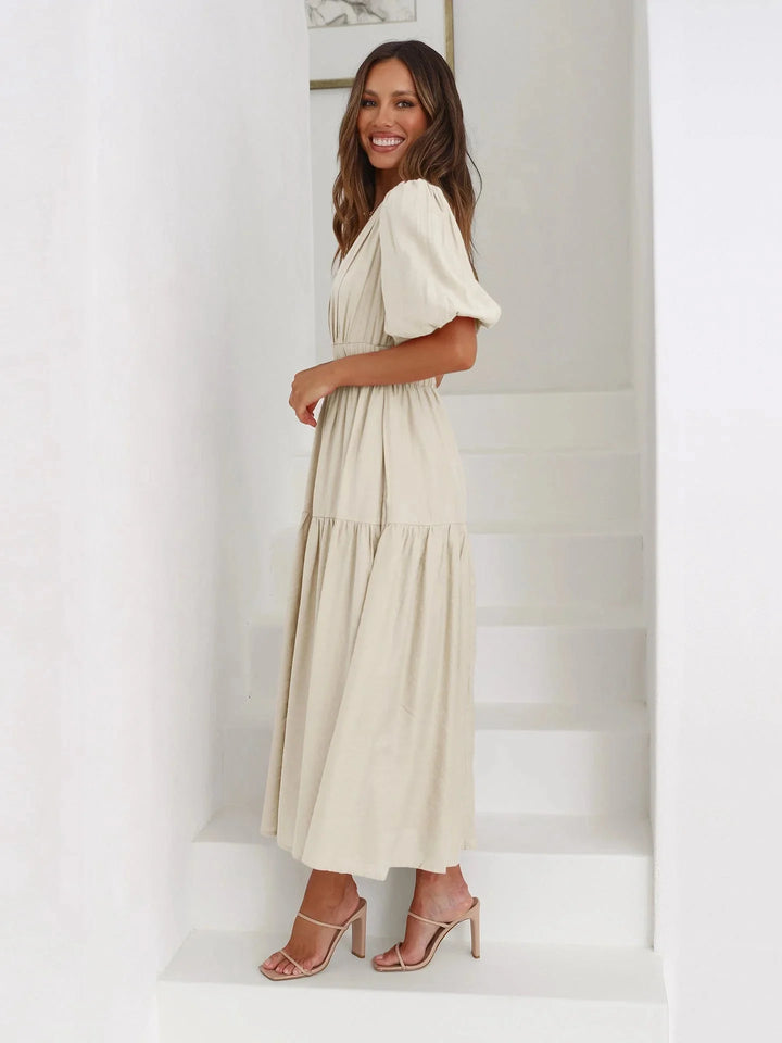 "Flowy dress with puff sleeves in lightweight fabric, elastic waist, perfect for a casual chic look."