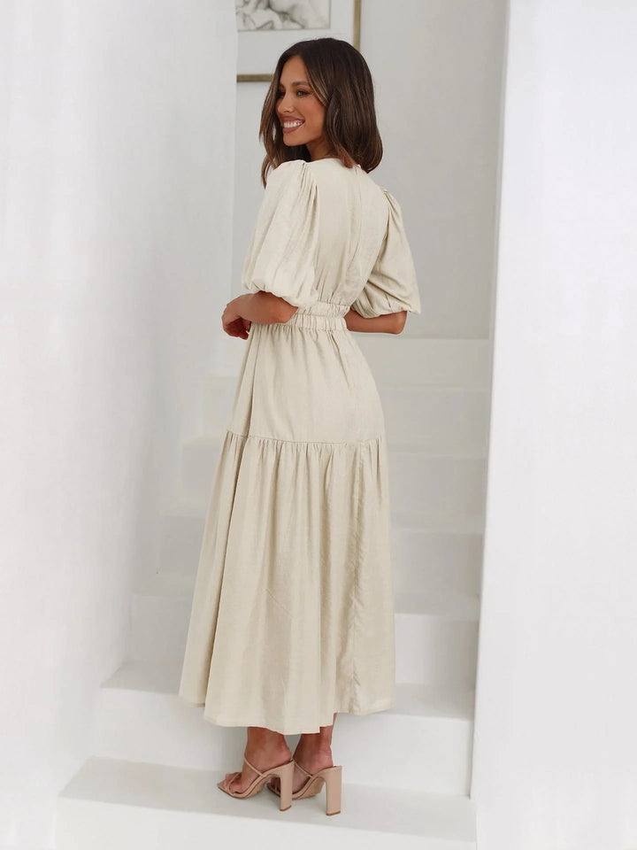 Eira dress: Soft and flowy with elastic waist and puff sleeves in a light, breathable fabric.