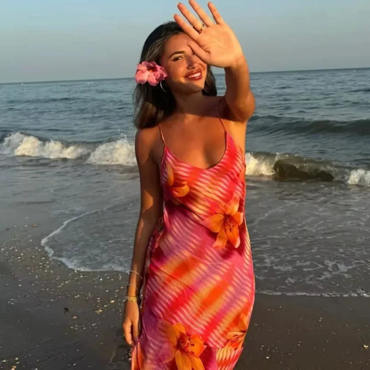 Pink maxi dress with floral accents, a breezy and feminine design for women.