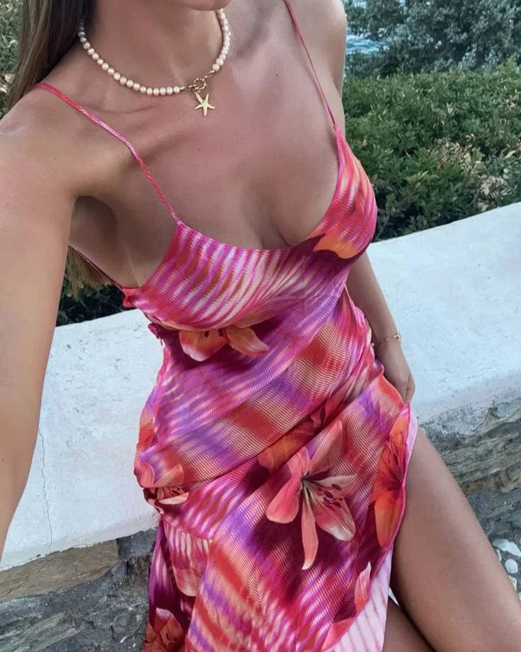 Pink maxi dress for women with floral detailing. Soft and lightweight fabric, perfect for a summer day out.