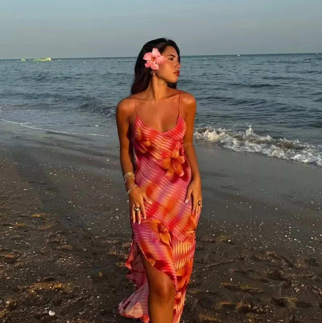 "Pink maxi dress featuring floral accents, perfect for a stylish summer look. Made from lightweight and breathable material."