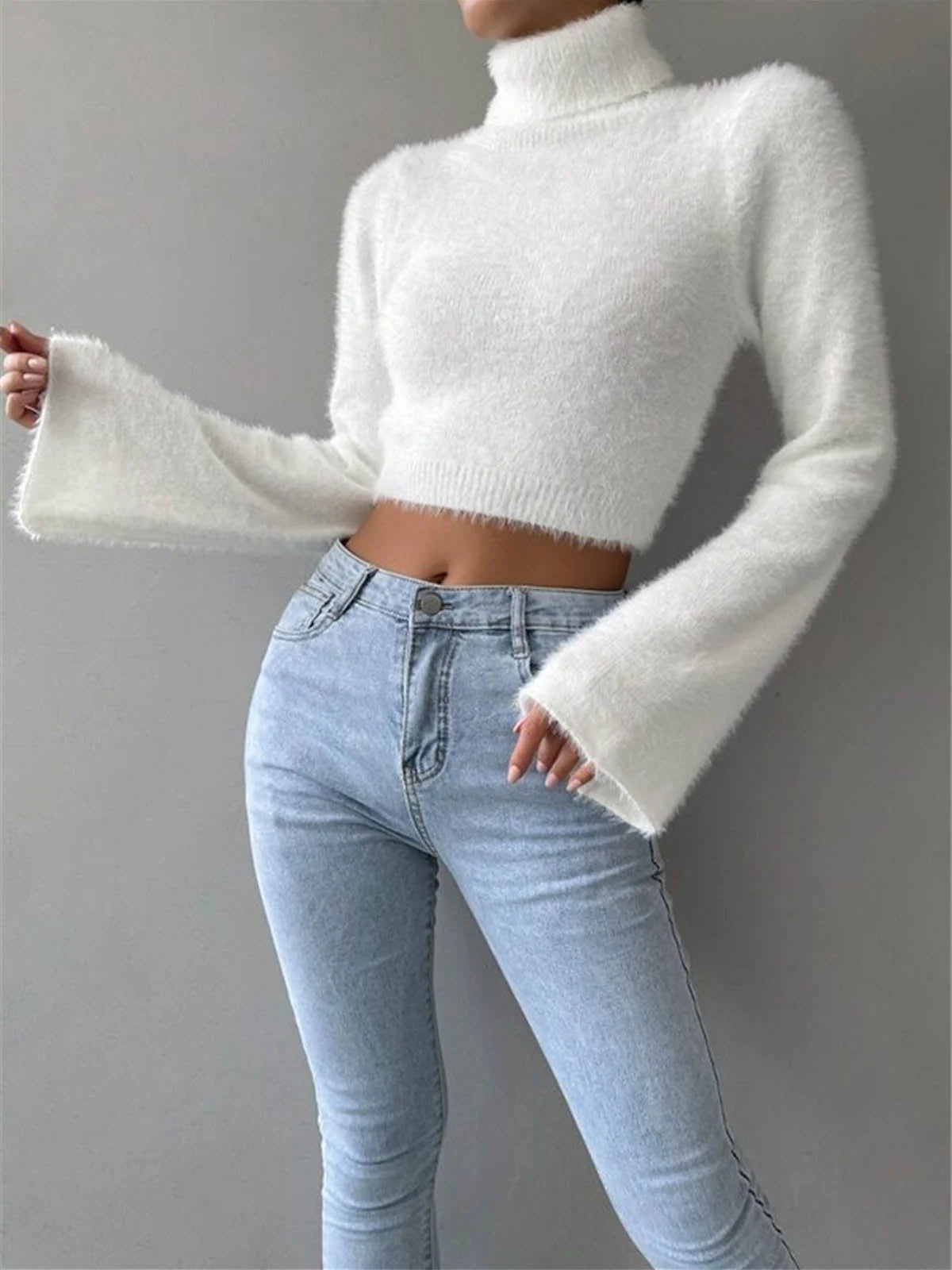 "Soft and cozy cropped fluffy sweater with a high neck design by Eleia"