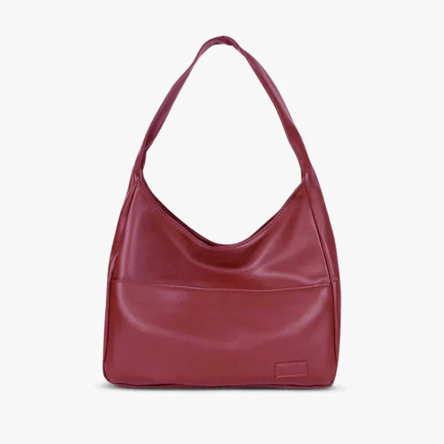 Eliette wine red shoulder bag made from smooth faux leather in a streamlined design with gold-tone hardware accents.