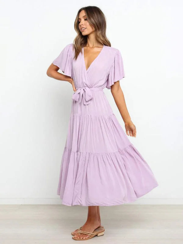 Fuchsia belted V-neck midi dress with flutter sleeves, perfect for summer days. Made of lightweight, breathable fabric for…