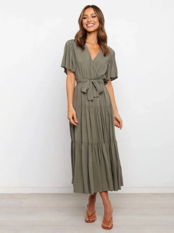 Olive green belted midi dress with flutter sleeves, perfect for casual chic.