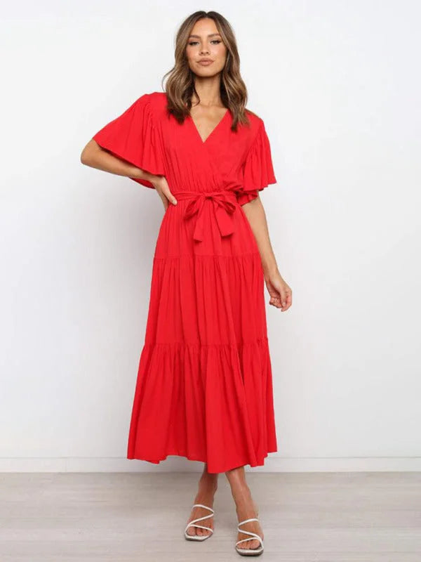 Red belted V-neck midi dress with flutter sleeves made of soft, flowing fabric for a comfortable and stylish ensemble.