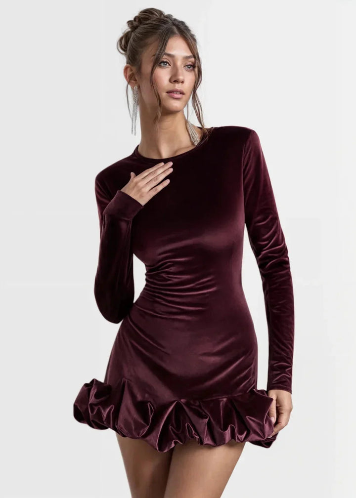 Women’s velvet dress in black with chic ruffles, perfect for special occasions.