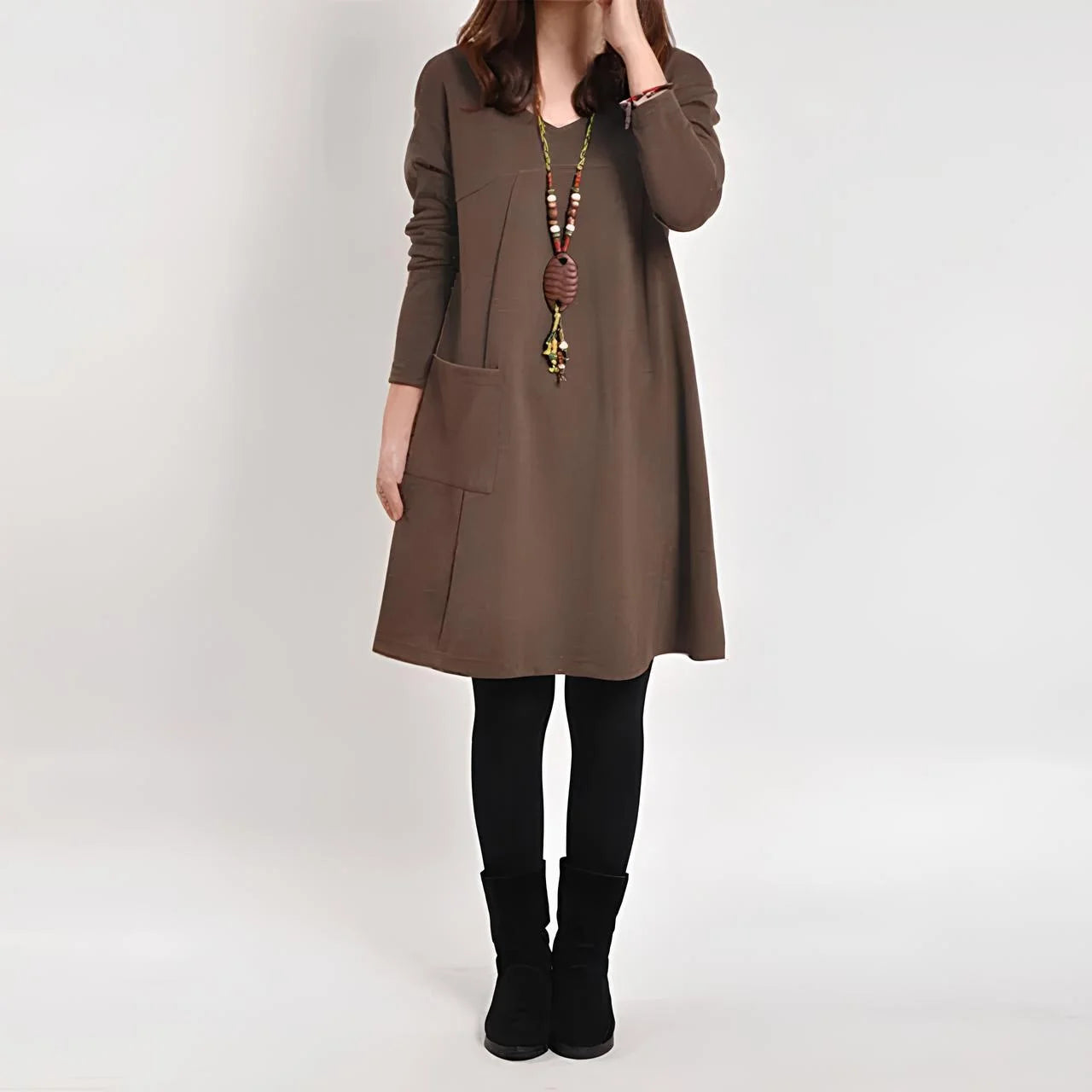 Brown Shift dress with functional pockets made from soft, breathable fabric. Features a simple, elegant design perfect for…