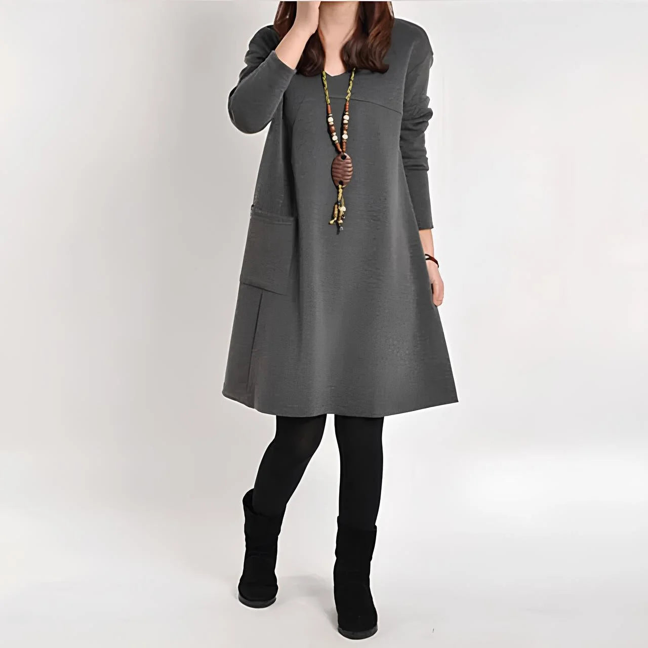 Gray Emeri shift dress with functional pockets, made from soft and breathable fabric. Features a versatile design suitable…